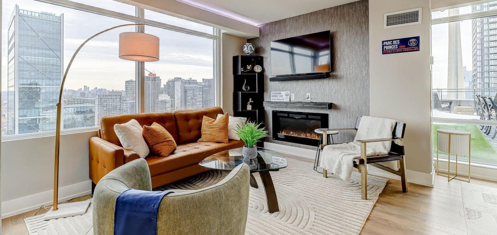 PH5201 living room with floor-to-ceiling skyline views